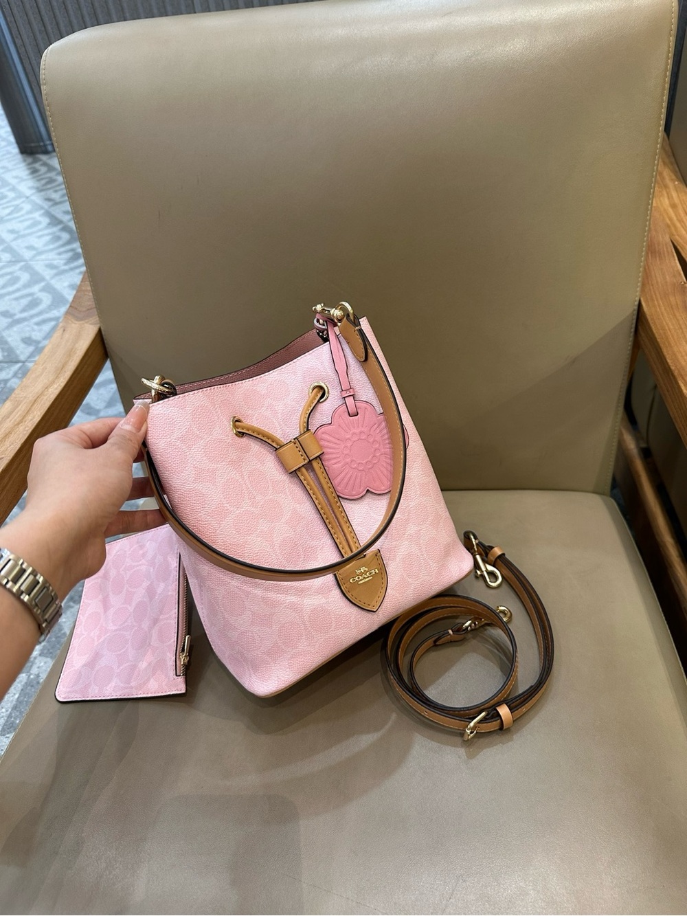Coach Pink Pebble Leather Drawstring Bucket Bag with Tan Trim and Floral Charm - Picture 2 of 9